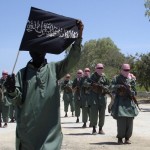 Militants of al Shabaab train with weapons on a street in the outskirts of Mogadishu